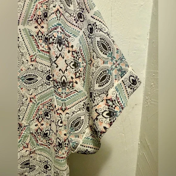 Maurices White and Green Blouse with Playful Pattern and Short Sleeves - Picture 3 of 10